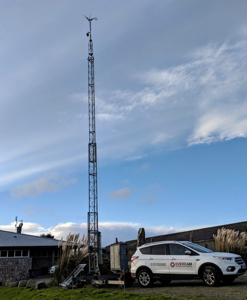 Evercam Car next to Solar & Wind Powered Mobile Mast for Time-lapse CCTV